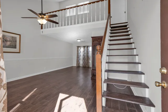 a view of an entryway with wooden floor