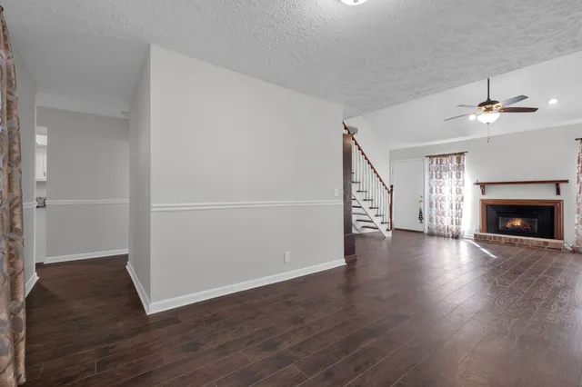 a view of a livingroom with wooden floor