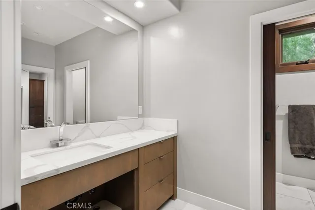 a bedroom with a bed and a potted plant