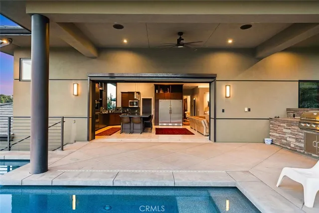 a view of a backyard with plants and a slide