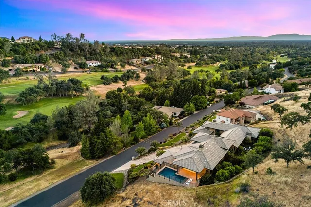 a view of a balcony with couches and wooden floor