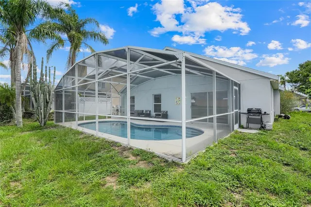 a view of a backyard with a large tree