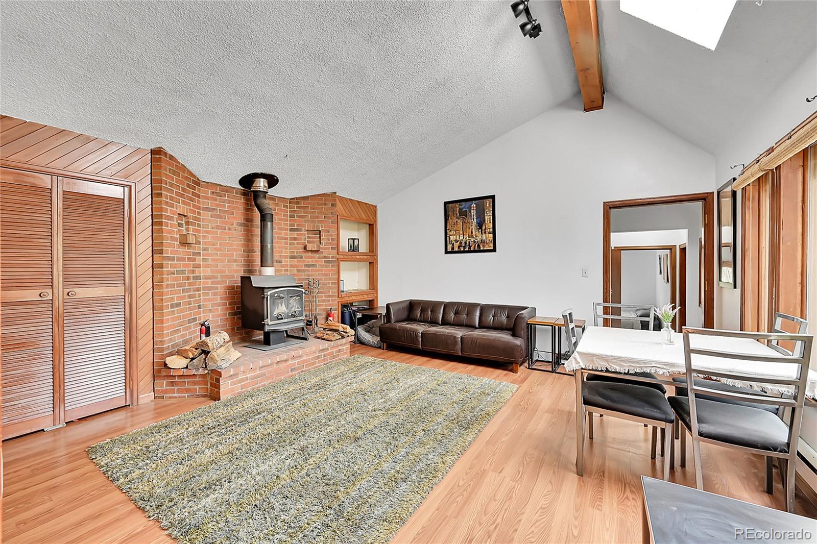 101 Campbell Road Bailey, CO 80421 - Photo 16 of 49 a bedroom with furniture and a wooden floor