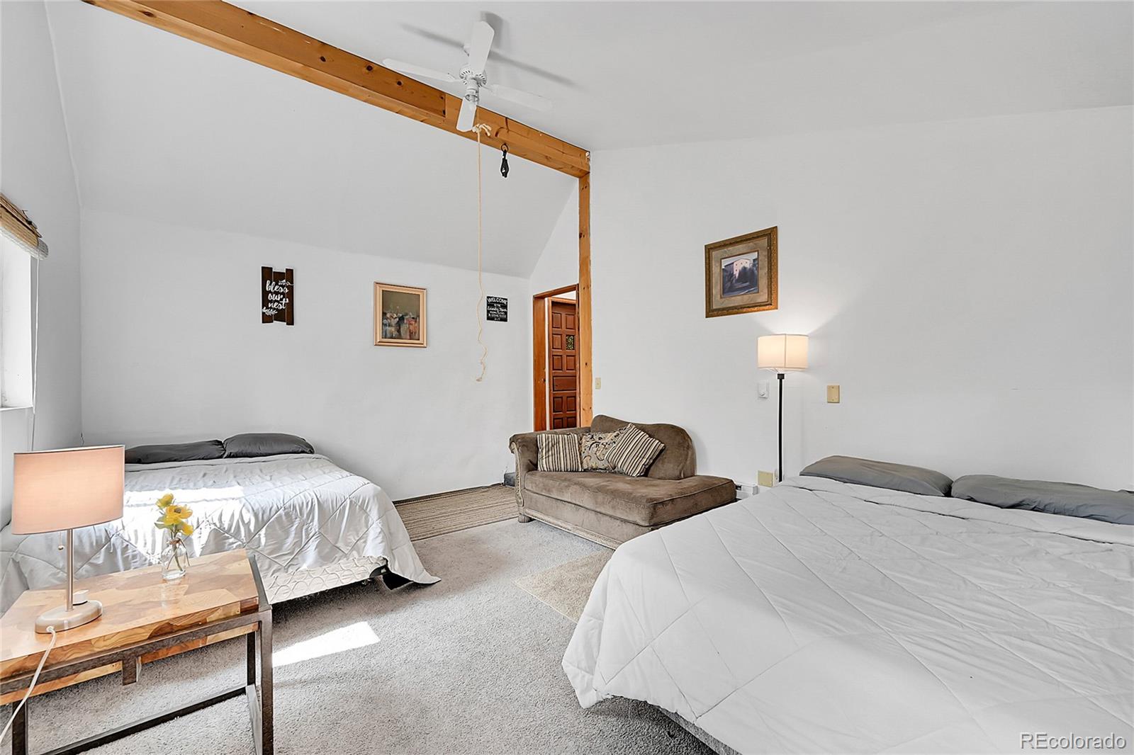 101 Campbell Road Bailey, CO 80421 - Photo 24 of 49 a bedroom with bed and a window