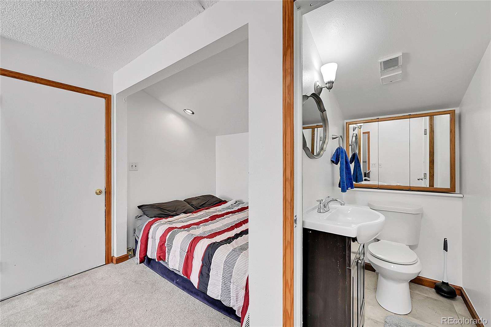 101 Campbell Road Bailey, CO 80421 - Photo 29 of 49 a bathroom with a sink and a mirror
