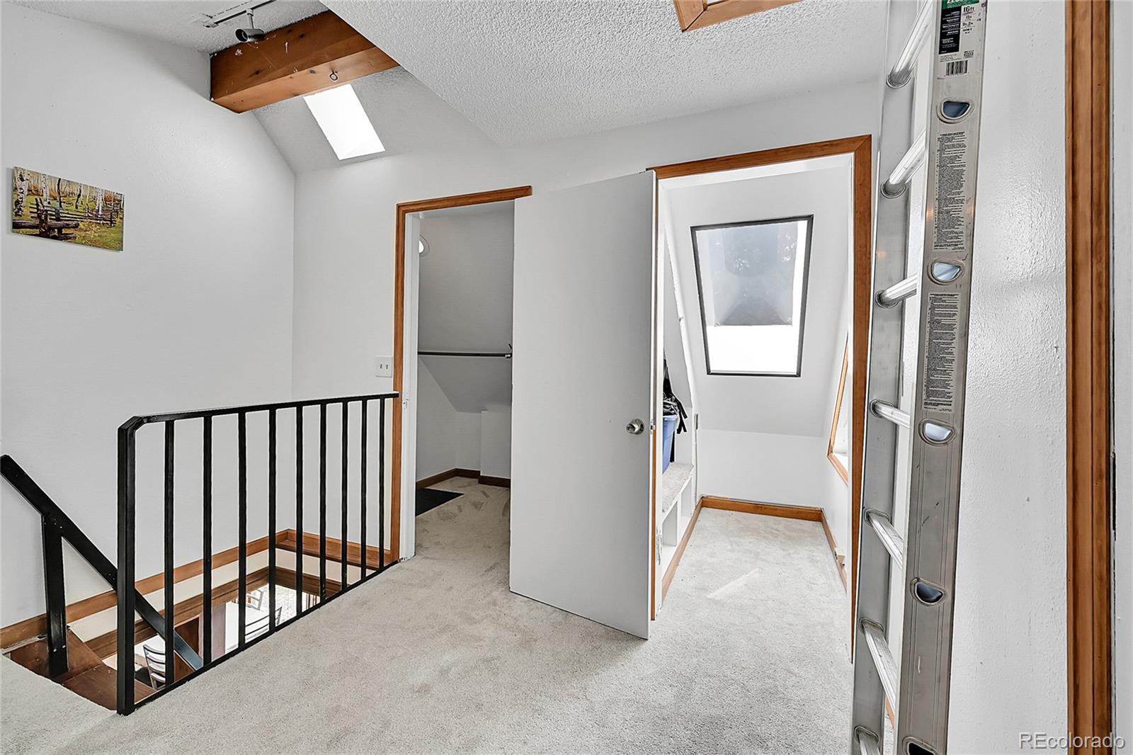 101 Campbell Road Bailey, CO 80421 - Photo 31 of 49 a view of a hallway with a livingroom and a bedroom