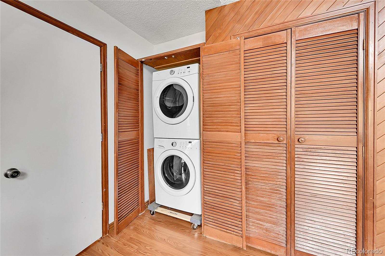 101 Campbell Road Bailey, CO 80421 - Photo 36 of 49 a view of a hallway with washer and dryer