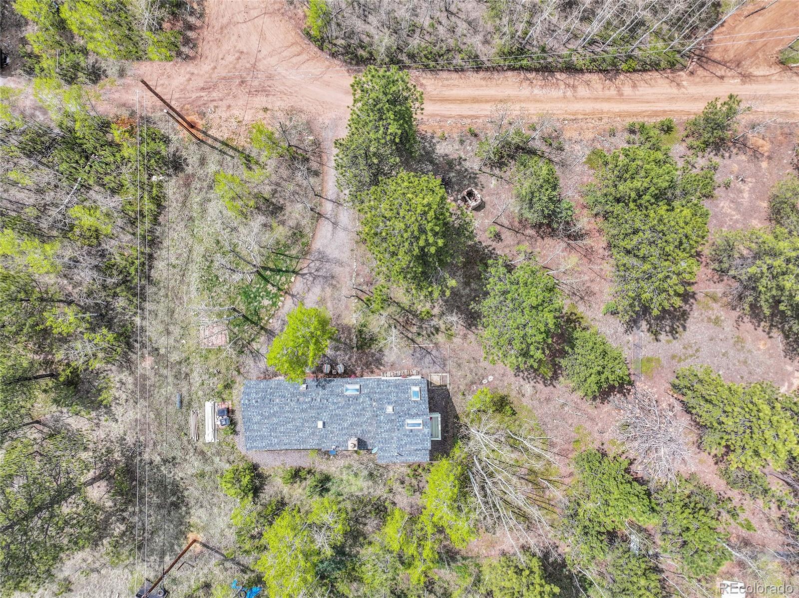 101 Campbell Road Bailey, CO 80421 - Photo 44 of 49 a aerial view of a house with a yard