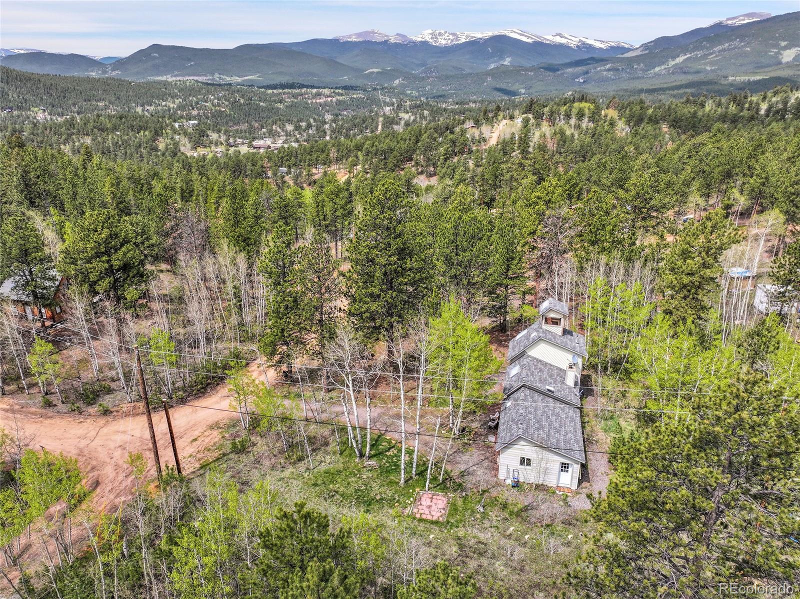 101 Campbell Road Bailey, CO 80421 - Photo 46 of 49 a view of a town with mountains in the background