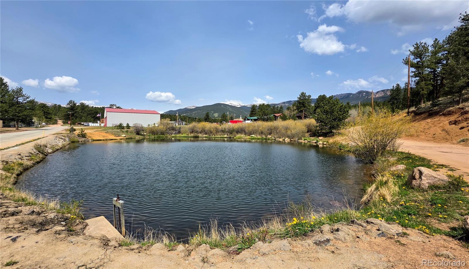 101 Campbell Road Bailey, CO 80421 - Photo 47 of 49 a view of a lake with a mountain
