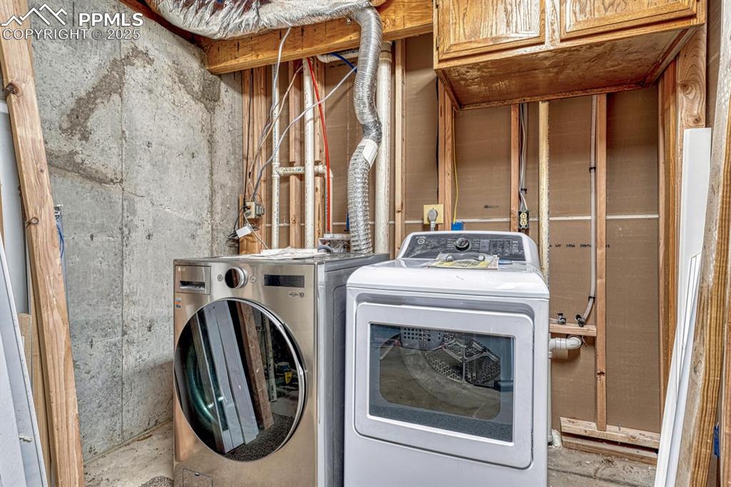 7550 Soap Weed Road Calhan, CO 80808 - Photo 41 of 50 a utility room with dryer and washer