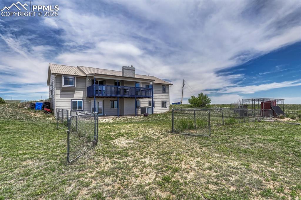 7550 Soap Weed Road Calhan, CO 80808 - Photo 47 of 50 a view of a house with a yard