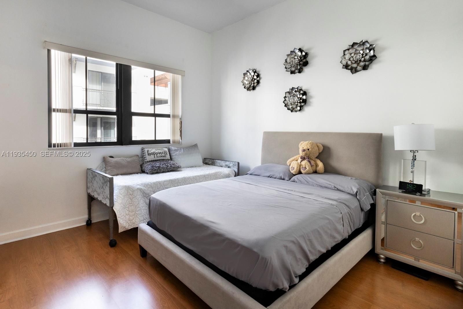 8395 Southwest 73rd Avenue, Unit 521 Miami, FL 33143 - Photo 13 of 21 a bedroom with a bed and window