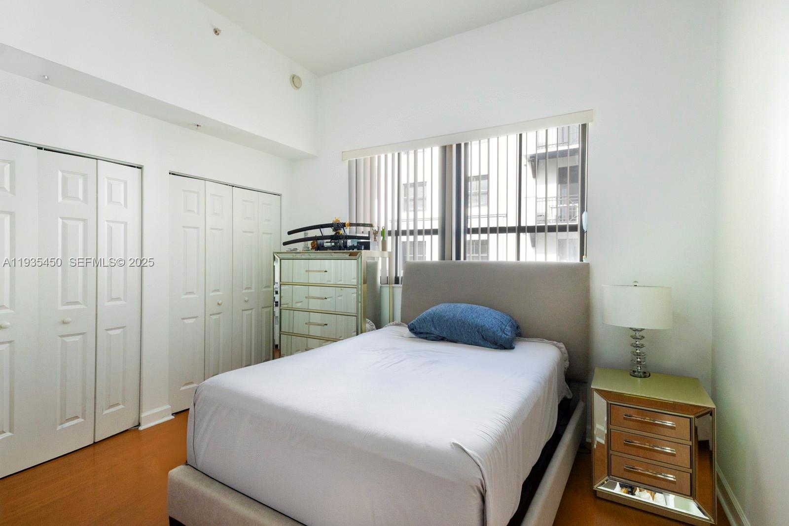 8395 Southwest 73rd Avenue, Unit 521 Miami, FL 33143 - Photo 15 of 21 a bedroom with a bed and a window