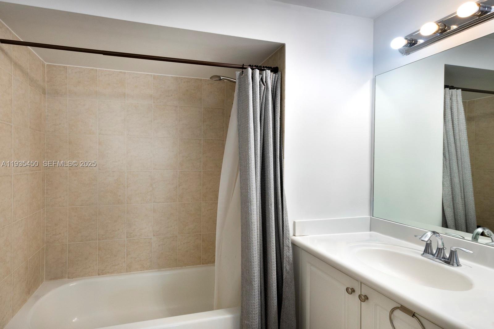 8395 Southwest 73rd Avenue, Unit 521 Miami, FL 33143 - Photo 16 of 21 a bathroom with a shower and a sink