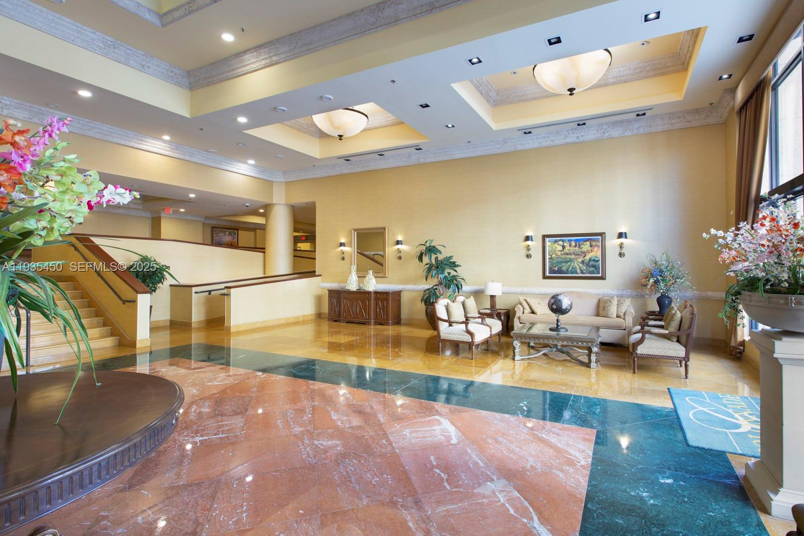 8395 Southwest 73rd Avenue, Unit 521 Miami, FL 33143 - Photo 18 of 21 a lobby with furniture and flowers