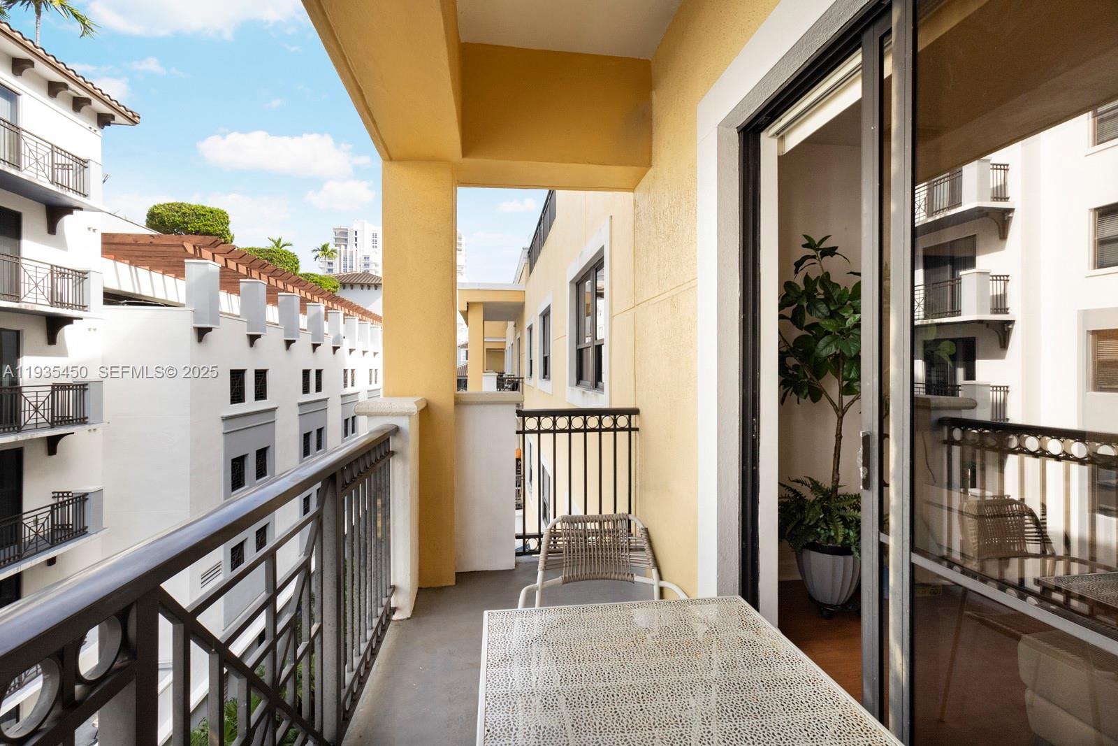 8395 Southwest 73rd Avenue, Unit 521 Miami, FL 33143 - Photo 8 of 21 a view of a balcony with wooden floor