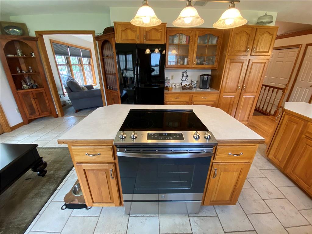 202 West Methodist Road Greenville, PA 16125 - Photo 10 of 25 a kitchen with granite countertop a stove and a refrigerator