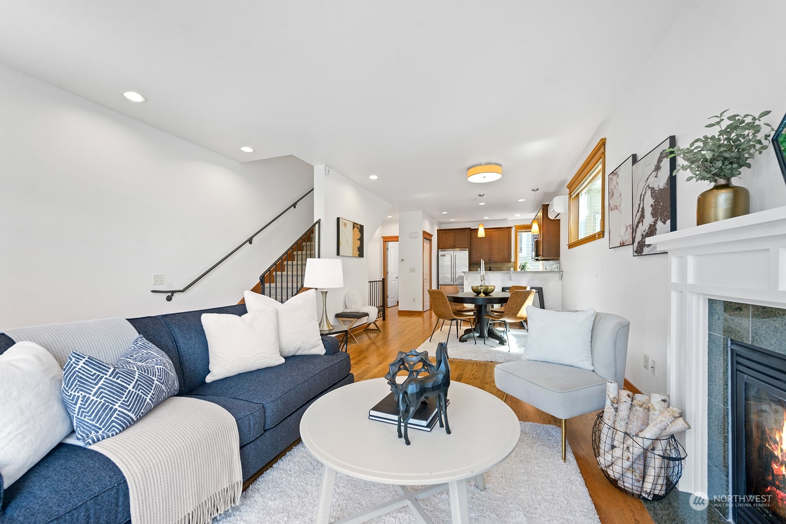 4309 Southwest Seattle Street Seattle, WA 98116 - Photo 13 of 36 a living room with furniture and a fireplace