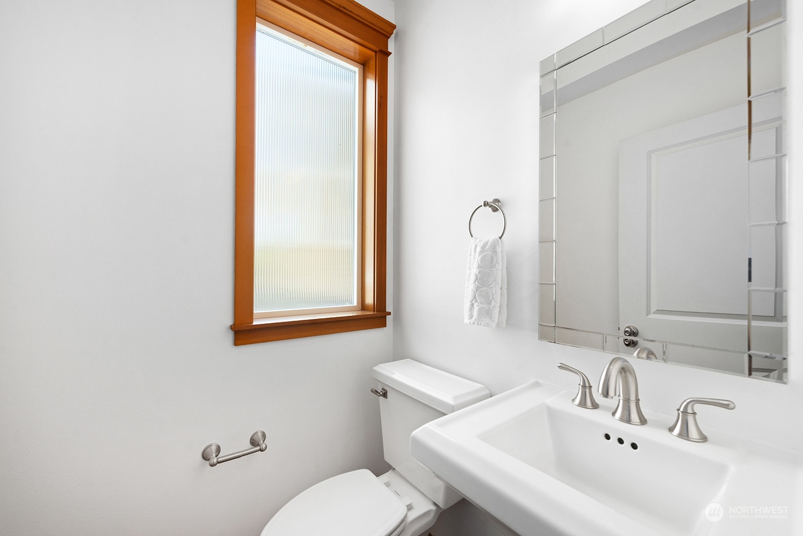 4309 Southwest Seattle Street Seattle, WA 98116 - Photo 18 of 36 a bathroom with a sink a toilet and mirror