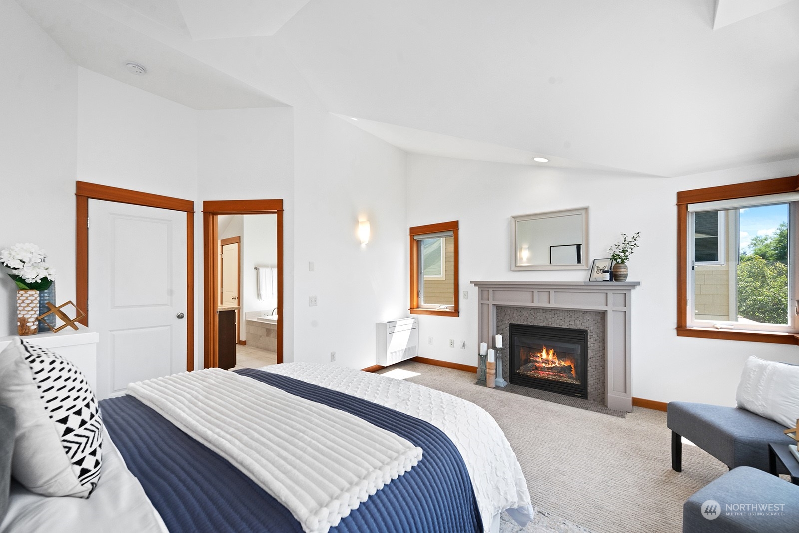 4309 Southwest Seattle Street Seattle, WA 98116 - Photo 19 of 36 a bedroom with a bed and a fireplace