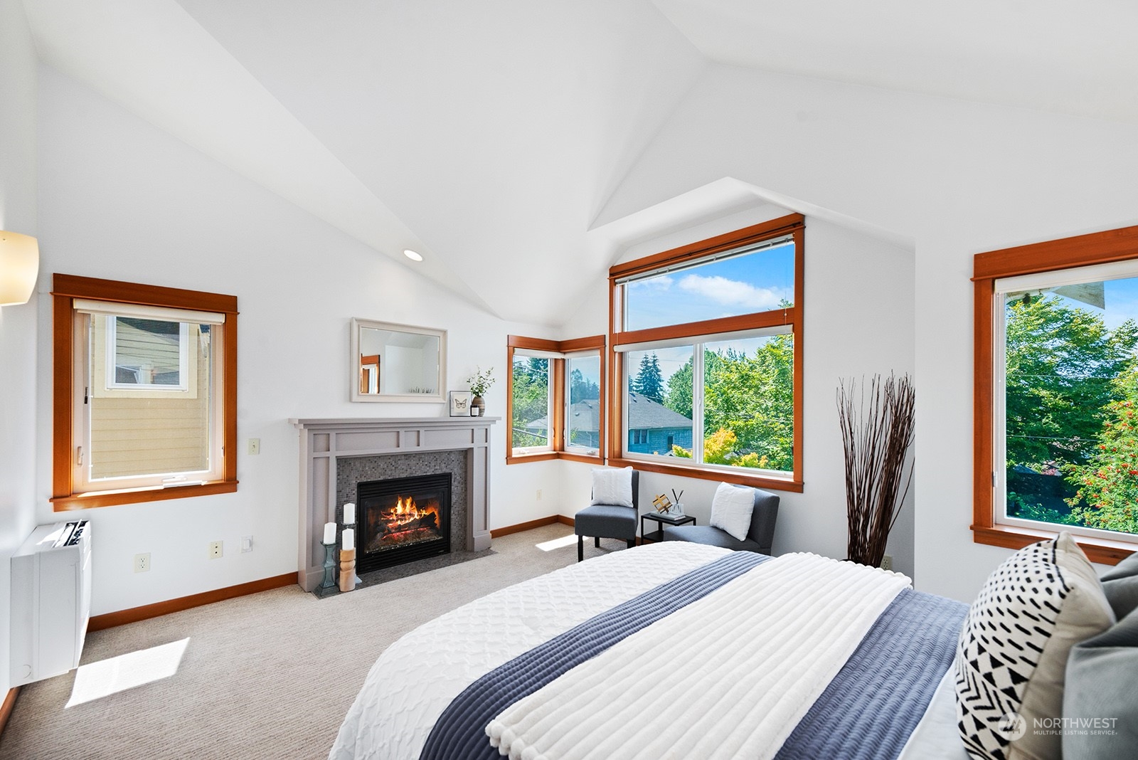 4309 Southwest Seattle Street Seattle, WA 98116 - Photo 20 of 36 a bedroom with a bed and a fireplace