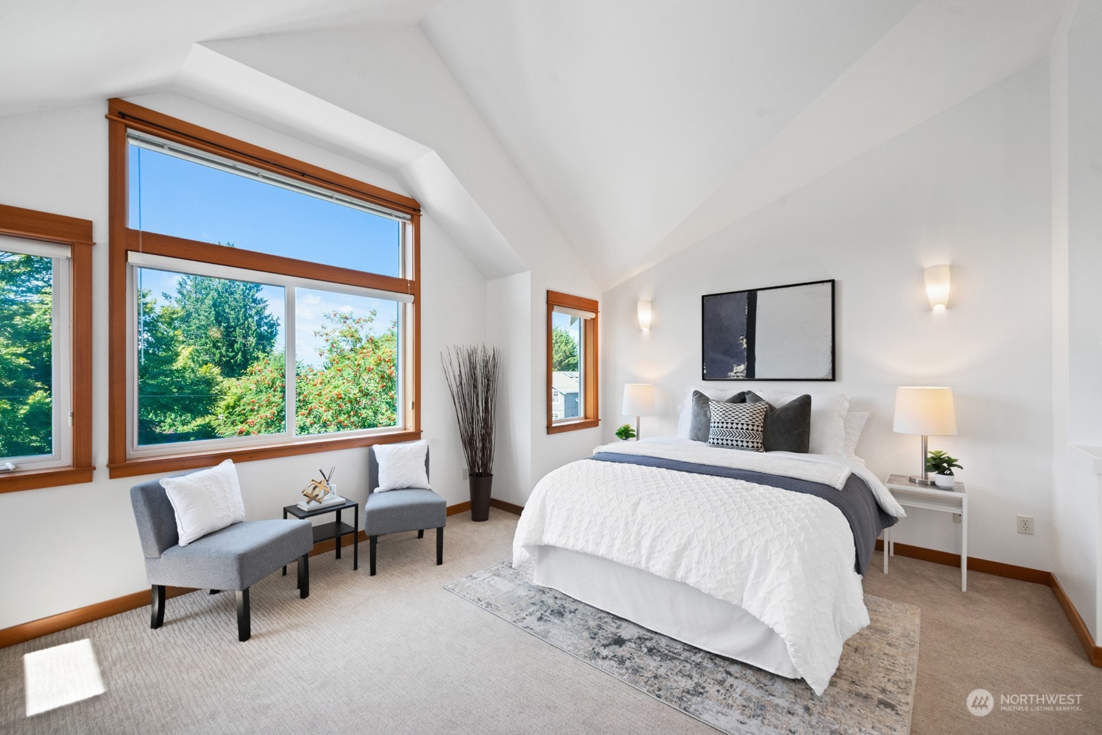 4309 Southwest Seattle Street Seattle, WA 98116 - Photo 21 of 36 a bedroom with a large bed and a large window