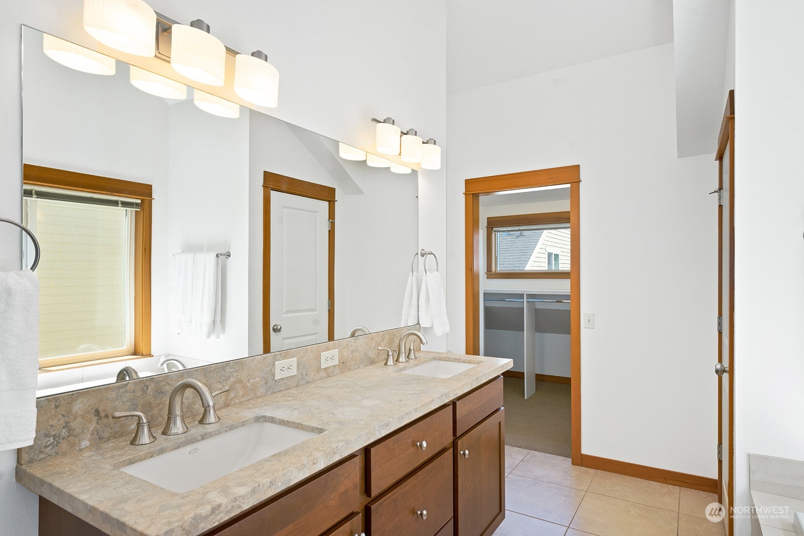 4309 Southwest Seattle Street Seattle, WA 98116 - Photo 23 of 36 a bathroom with a granite countertop sink and a mirror