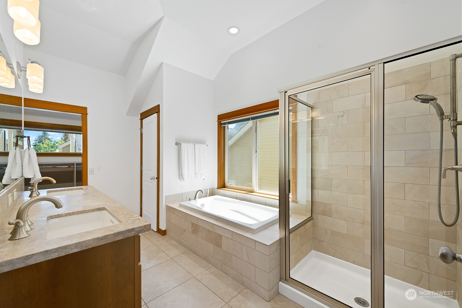 4309 Southwest Seattle Street Seattle, WA 98116 - Photo 24 of 36 a bathroom with a tub sink shower and mirror