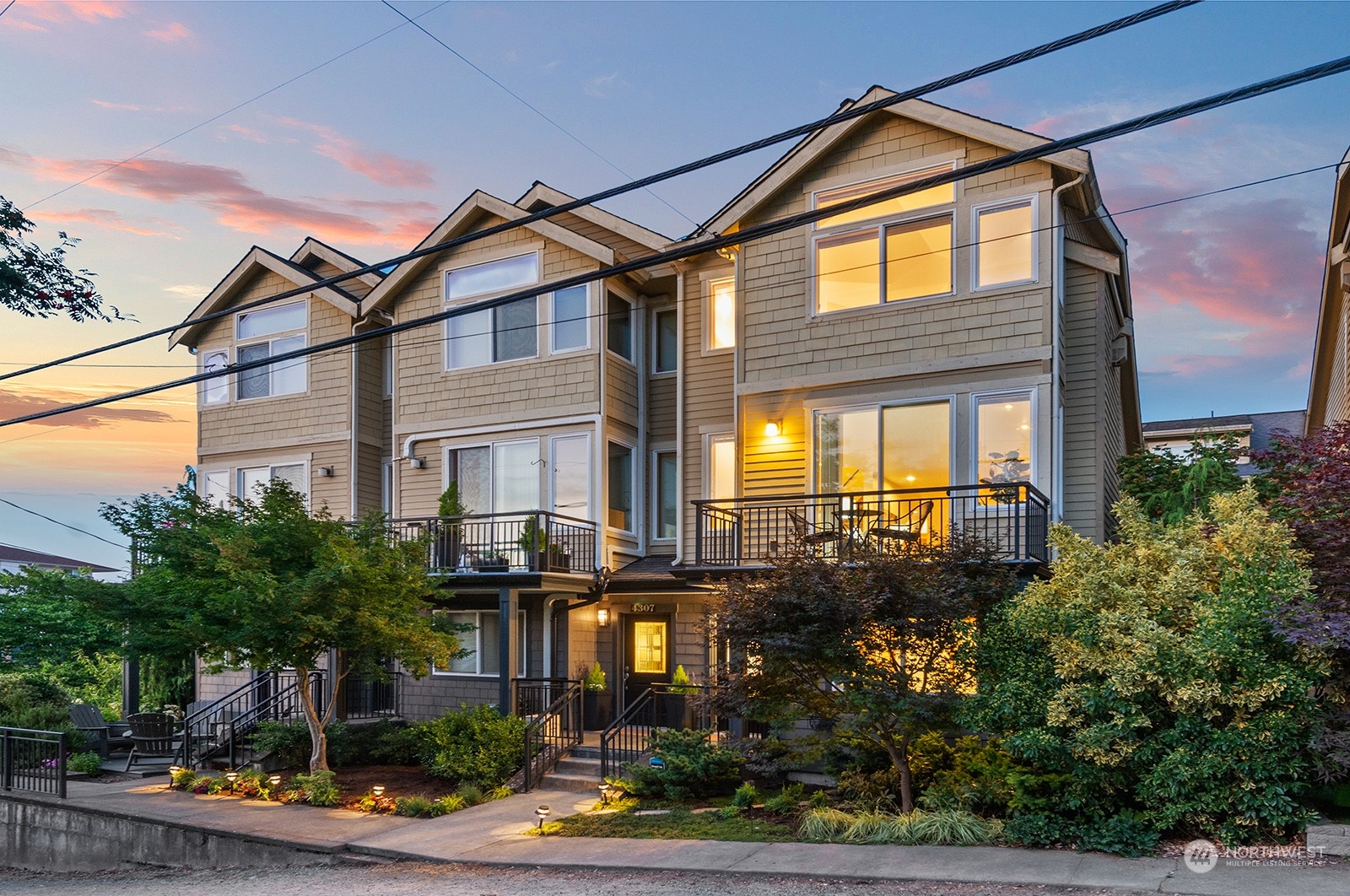 4309 Southwest Seattle Street Seattle, WA 98116 - Photo 34 of 36 a front view of a house with a garden