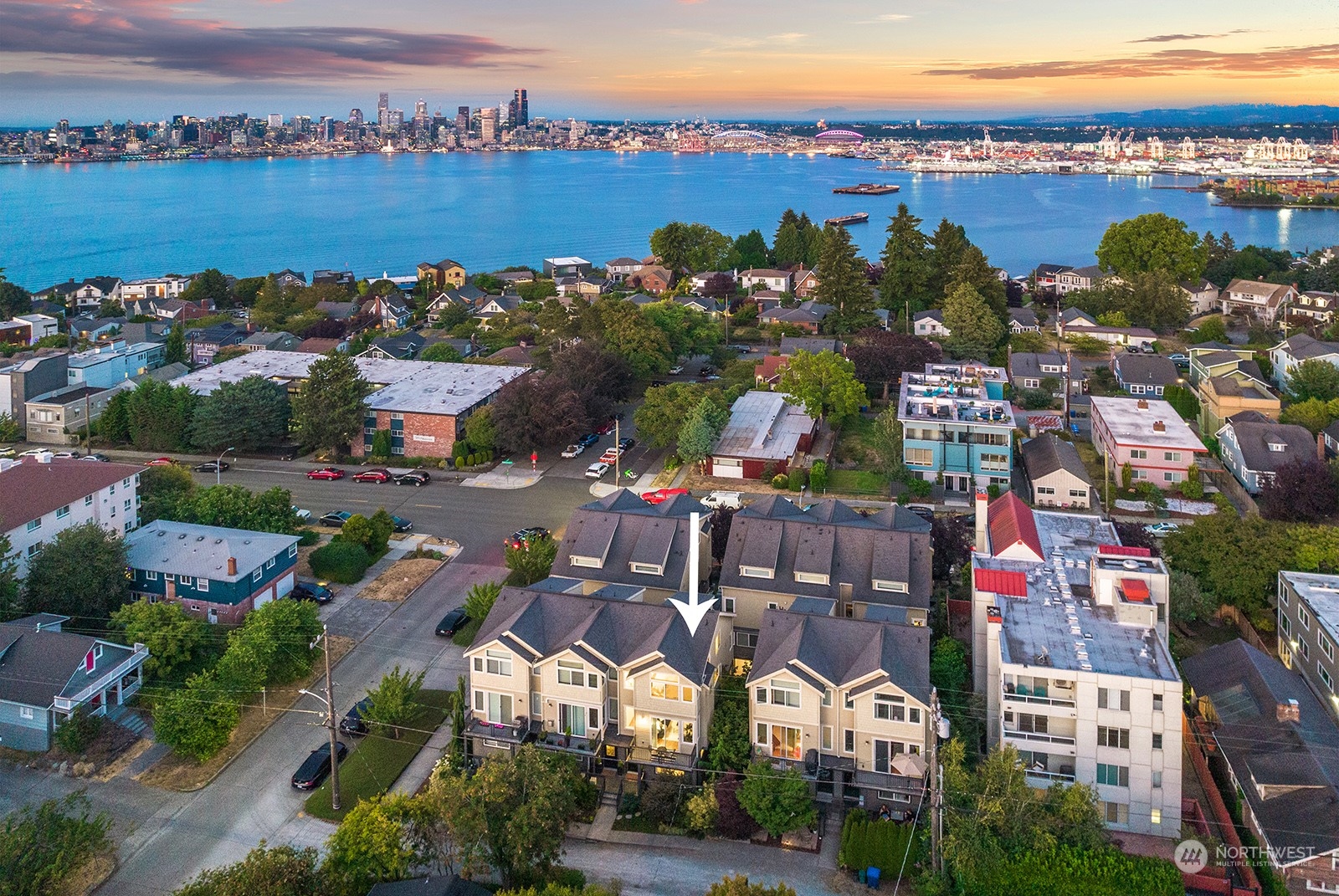 4309 Southwest Seattle Street Seattle, WA 98116 - Photo 36 of 36 an aerial view of a city with lots of residential buildings and ocean view in back