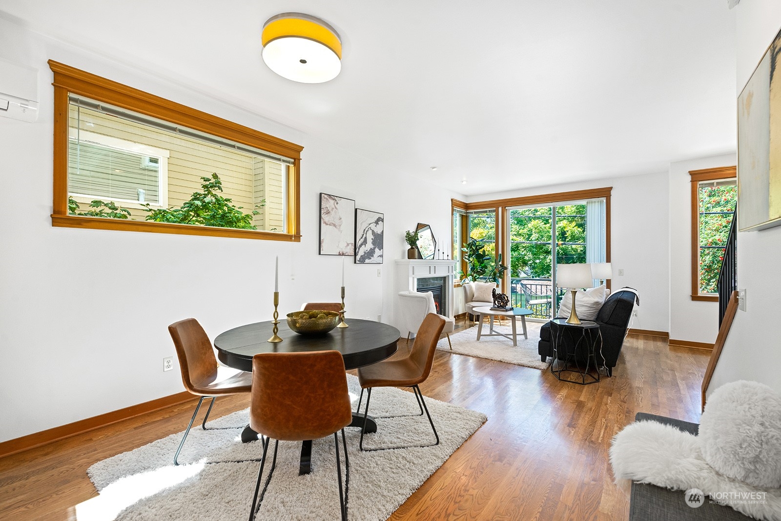 4309 Southwest Seattle Street Seattle, WA 98116 - Photo 9 of 36 a view of a dining room with furniture window and wooden floor