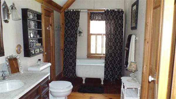 29 Potter Road Rowe, MA 01367 - Photo 20 of 30 a bathroom with a toilet a sink and a window