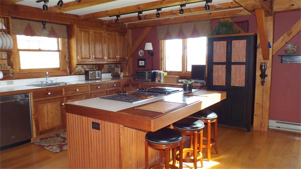 29 Potter Road Rowe, MA 01367 - Photo 5 of 30 a kitchen with a sink and a refrigerator