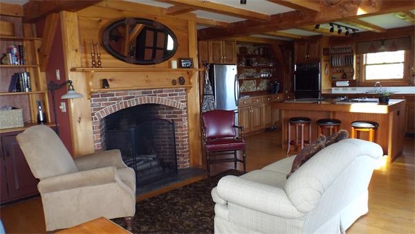 29 Potter Road Rowe, MA 01367 - Photo 7 of 30 a living room with furniture a flat screen tv and a fireplace