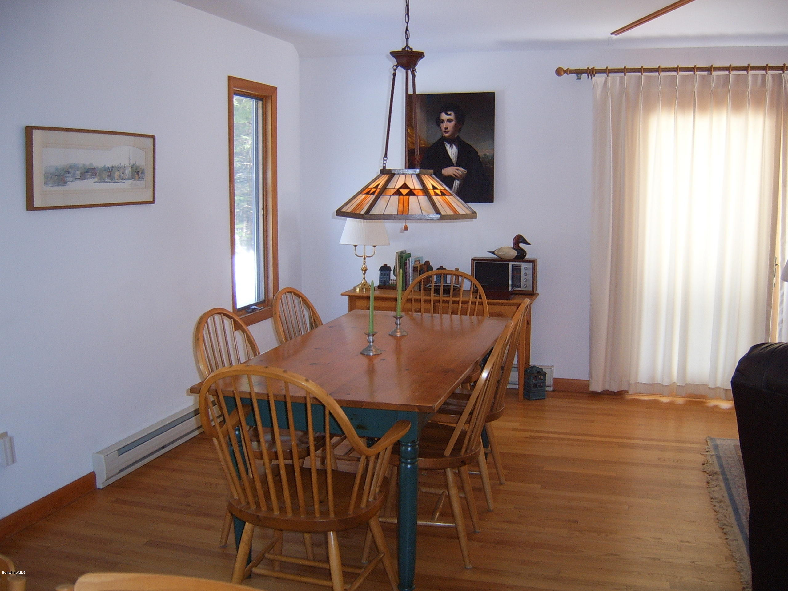 1820 Jacobs Ladder Road Becket, MA 01223 - Photo 3 of 30 a view of a dining room with furniture and window