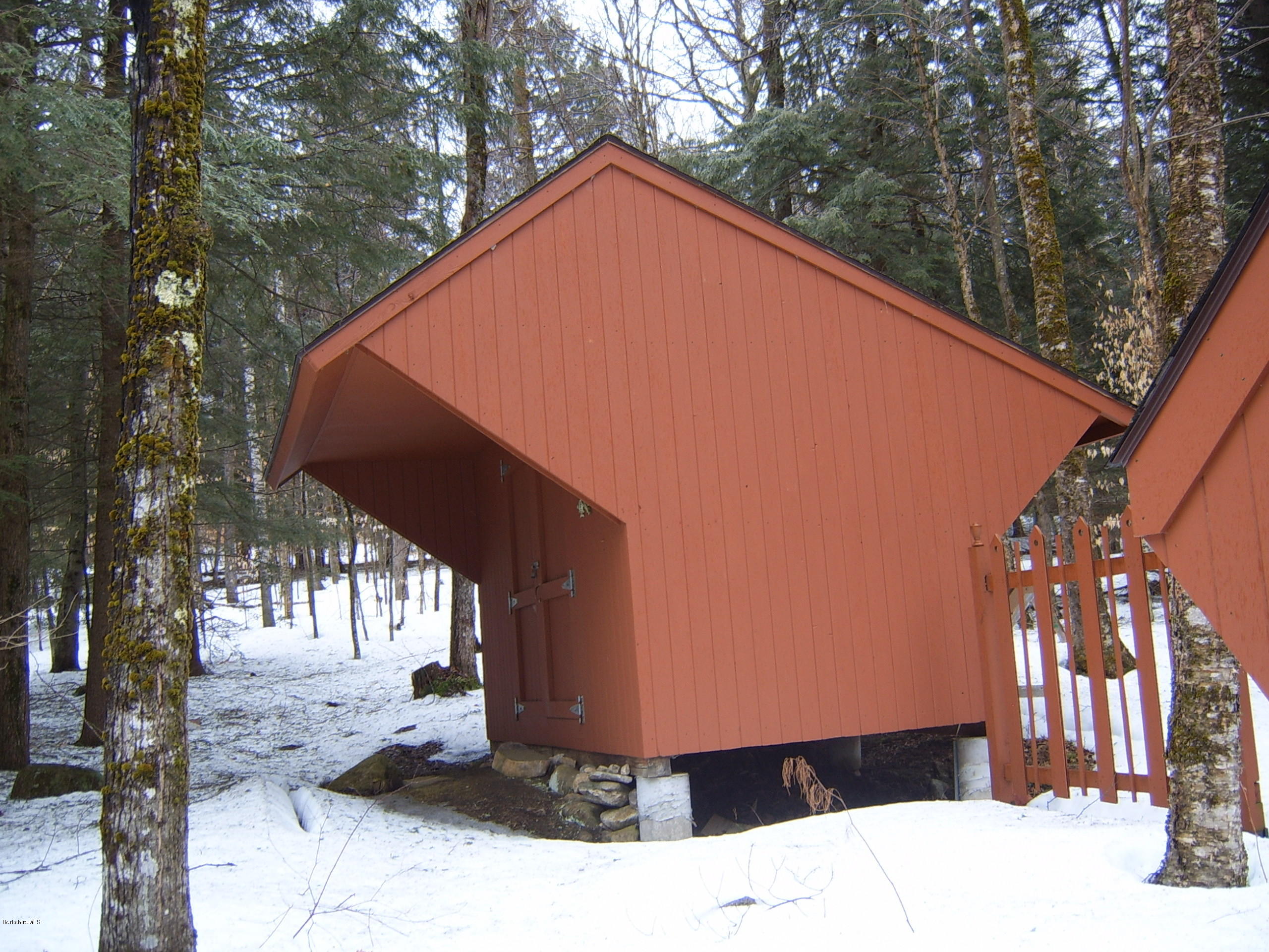 1820 Jacobs Ladder Road Becket, MA 01223 - Photo 7 of 30 a backyard of a house with large trees