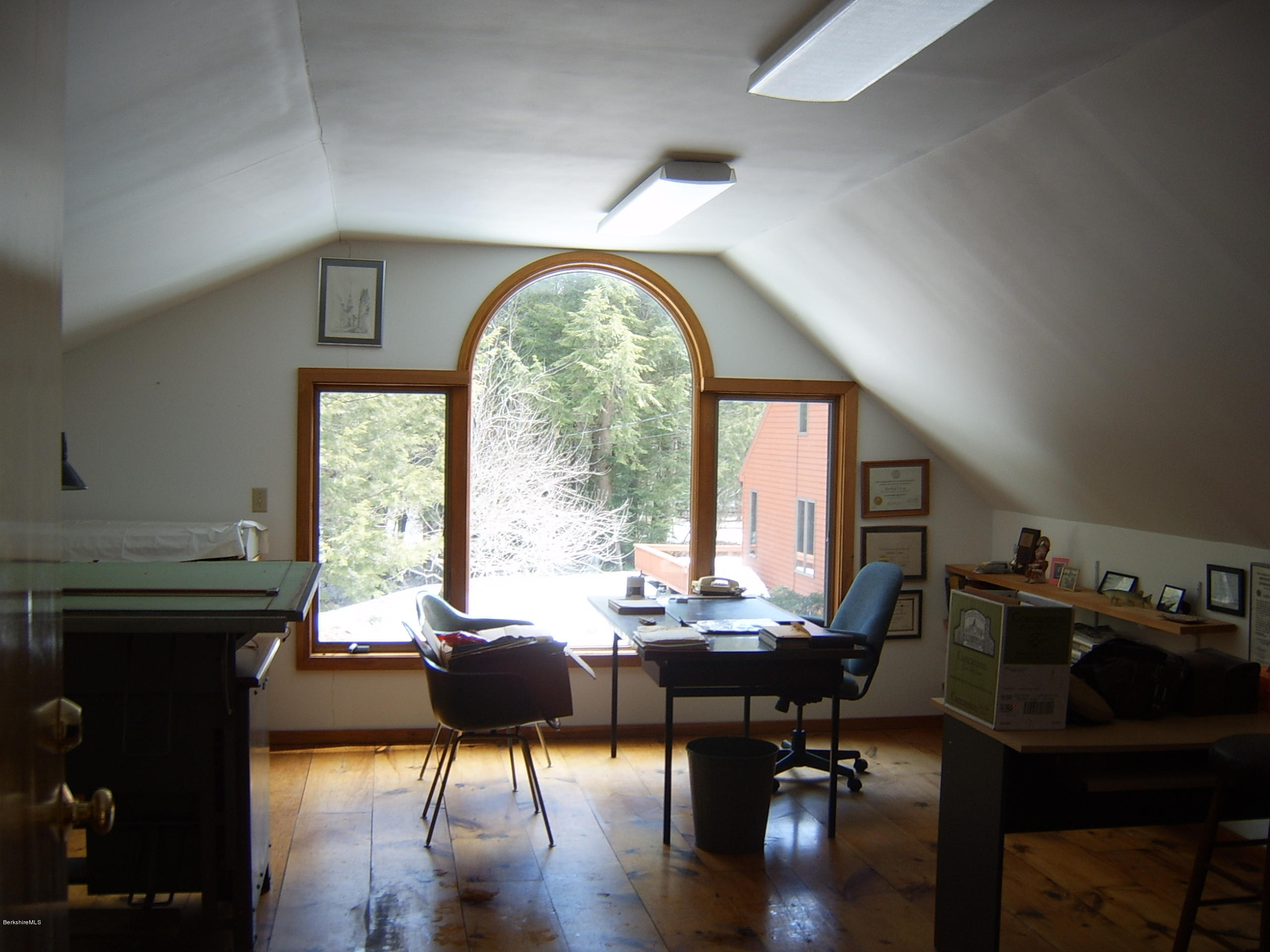1820 Jacobs Ladder Road Becket, MA 01223 - Photo 8 of 30 a living room with furniture a fireplace and a large window