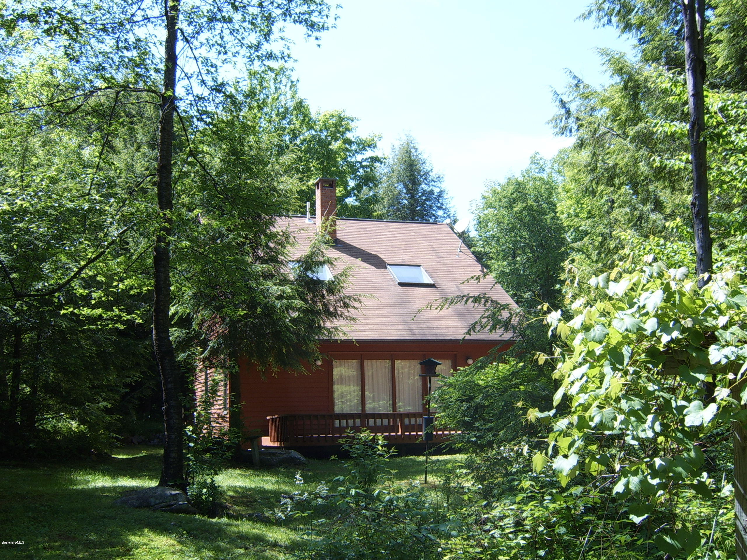 1820 Jacobs Ladder Road Becket, MA 01223 - Photo 9 of 30 an aerial view of a house with garden space and trees