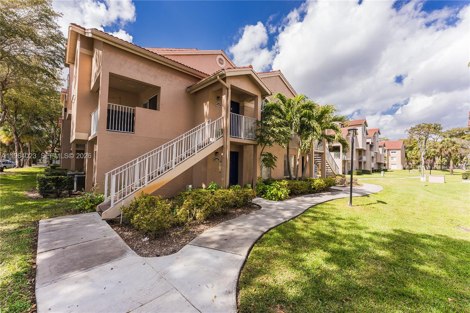 10521 Southwest 157th Place, Unit 102 Miami, FL 33196 - Photo 1 of 15 a house with swimming pool in front of it