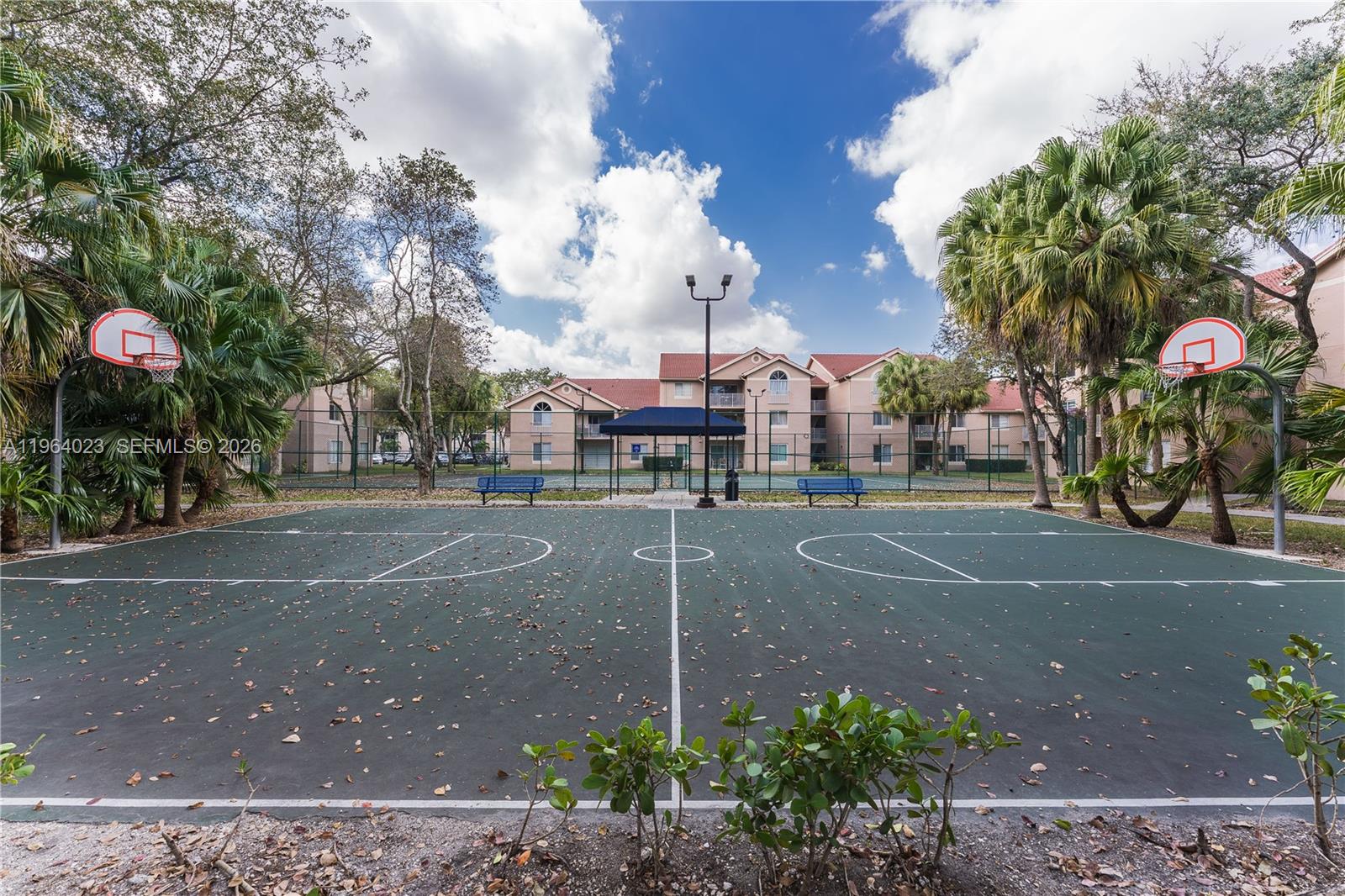 10521 Southwest 157th Place, Unit 102 Miami, FL 33196 - Photo 15 of 15 a sign board with buildings in the background