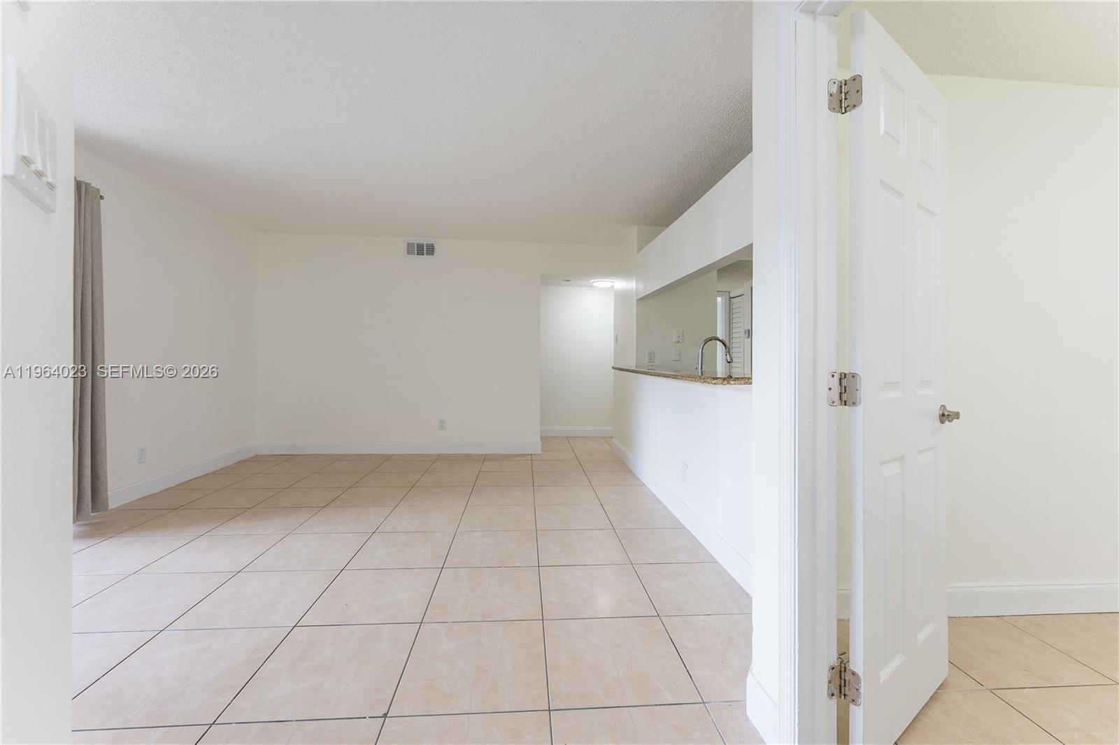 10521 Southwest 157th Place, Unit 102 Miami, FL 33196 - Photo 2 of 15 a view of a hallway