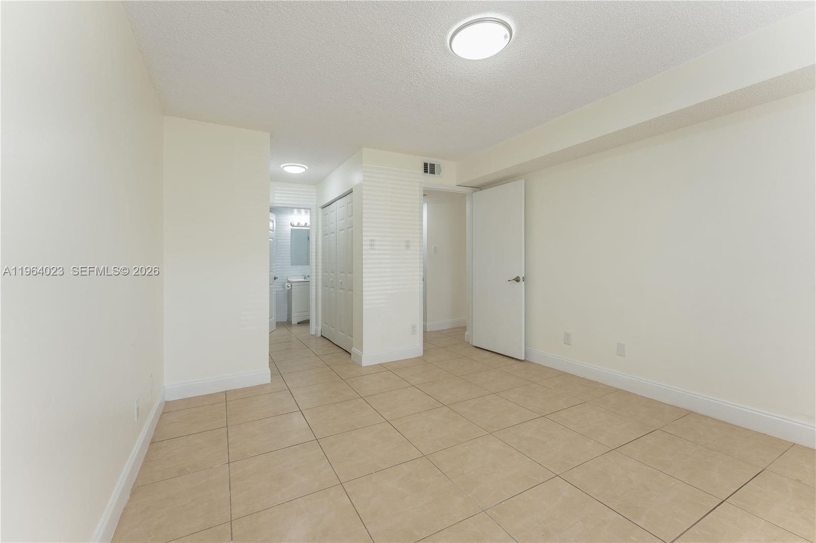 10521 Southwest 157th Place, Unit 102 Miami, FL 33196 - Photo 6 of 15 a view of an empty room
