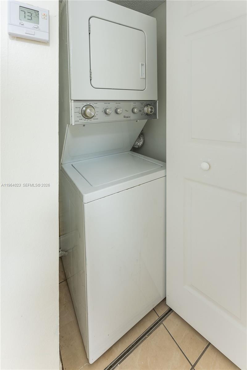 10521 Southwest 157th Place, Unit 102 Miami, FL 33196 - Photo 9 of 15 a utility room with dryer and washer