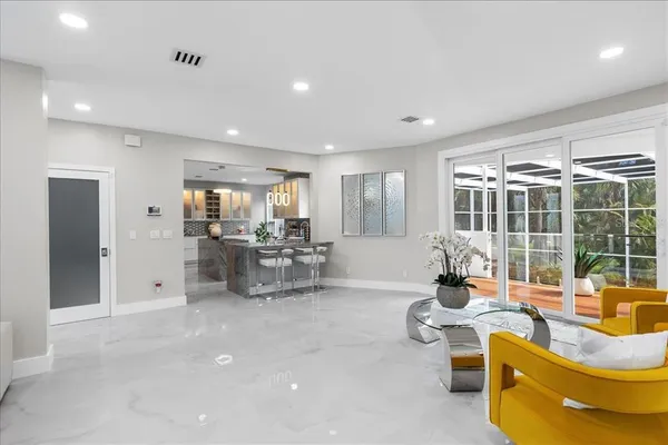a living room with furniture and a large window