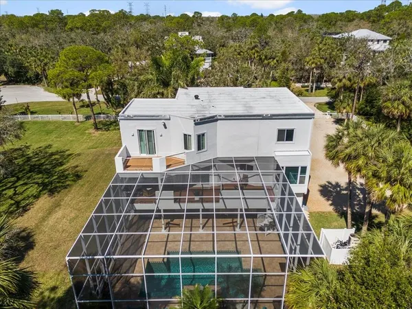 a view of house with backyard and garden