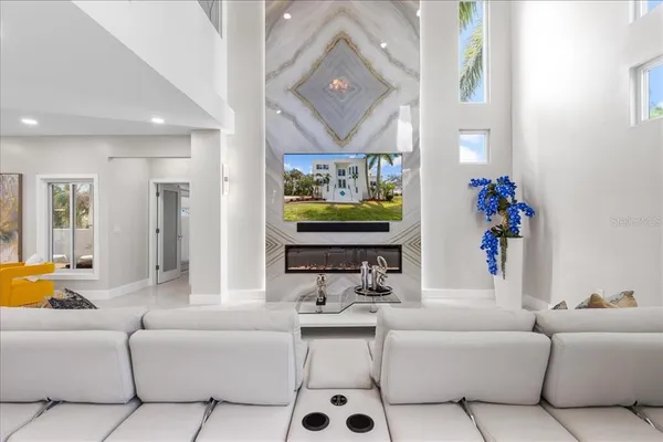 a kitchen with stainless steel appliances granite countertop a sink a stove and a wooden floors