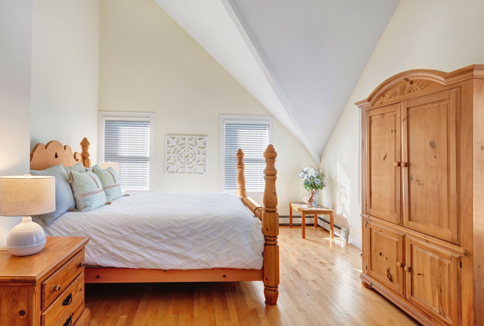 17 Thaxter Lane Edgartown, MA 02539 - Photo 11 of 23 a bedroom with furniture and a wooden floor