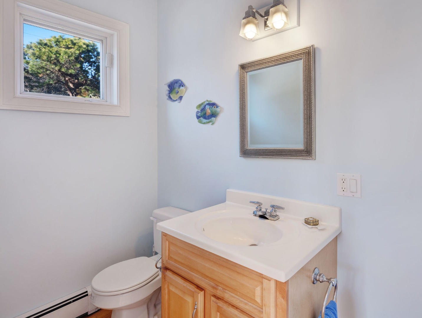 17 Thaxter Lane Edgartown, MA 02539 - Photo 20 of 23 a bathroom with a sink a toilet and mirror