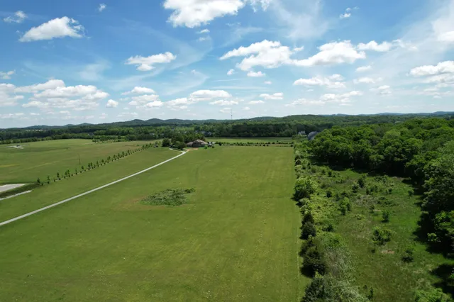 a view of a lake with a yard